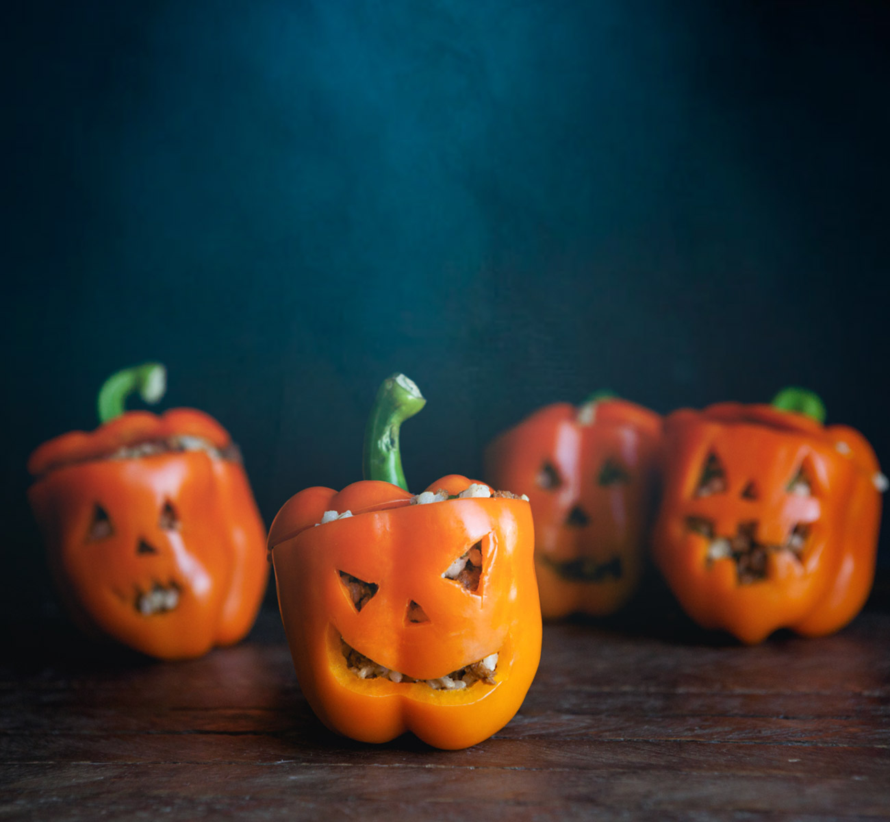 Spooky Stuffed Jack-o’-Lantern Peppers